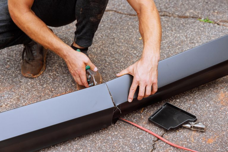 Amenity Roofing team working on a gutter system in Oswego, IL