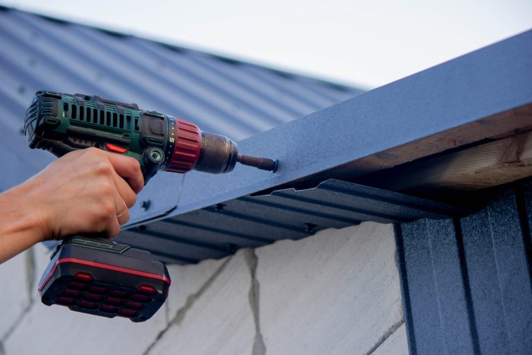 Technicians installing MasterShield gutter guards in Burlington, WI
