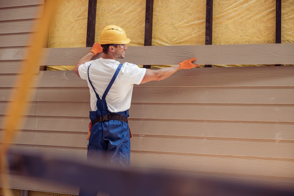 Professional siding installation on a Genoa City home