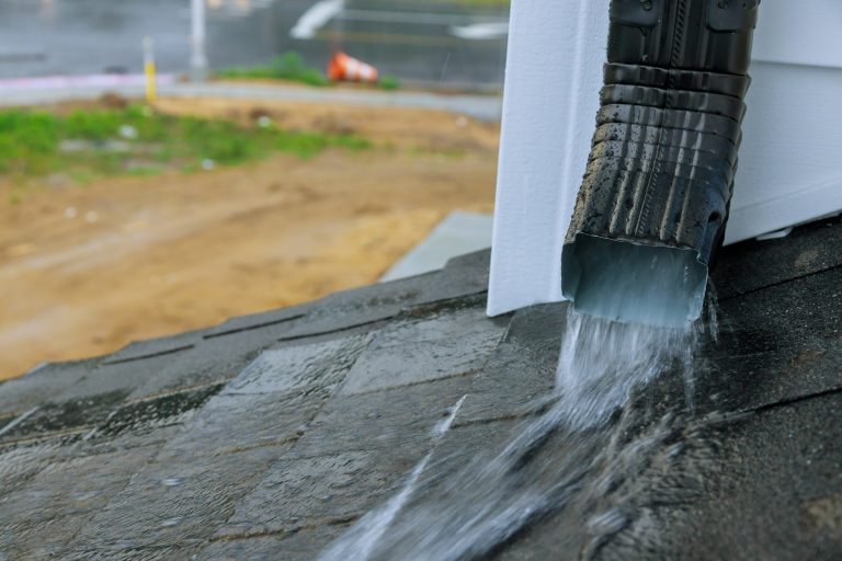 Technician repairing sagging gutter in North Aurora, IL