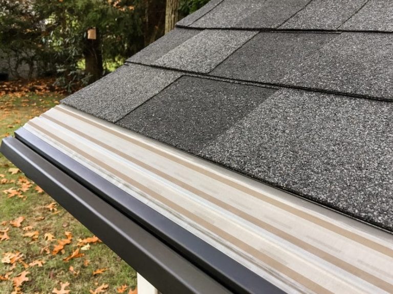 Technician installing MasterShield gutter guard on home in Delavan